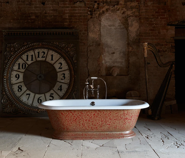 Duravit’s pentangle Paiova 5 bathtub (top) massages the relaxed body in two different positions, while Drummonds’ freestanding roll-top tub, The Tay (middle, bottom), is easy on the arms and eyes